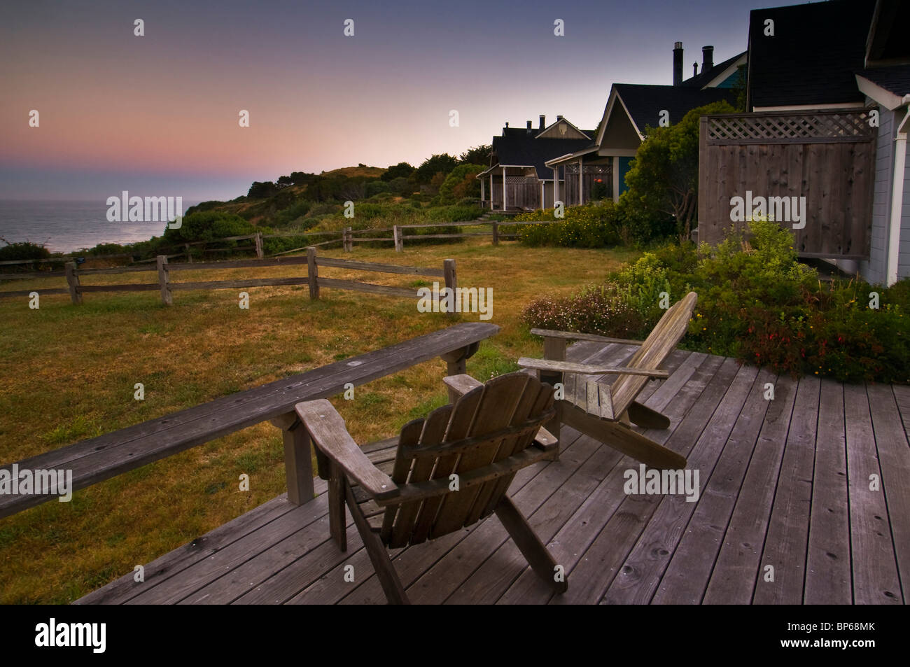 Wooden Deck Chairs With View Of Ocean From Guest Cottages At