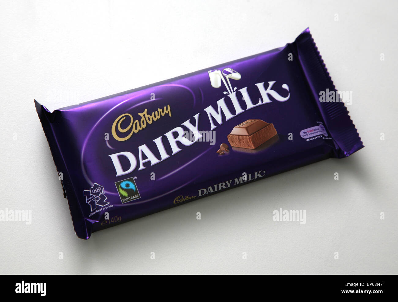 A bar of Cadbury Dairy Milk chocolate in its wrapper Stock Photo Alamy