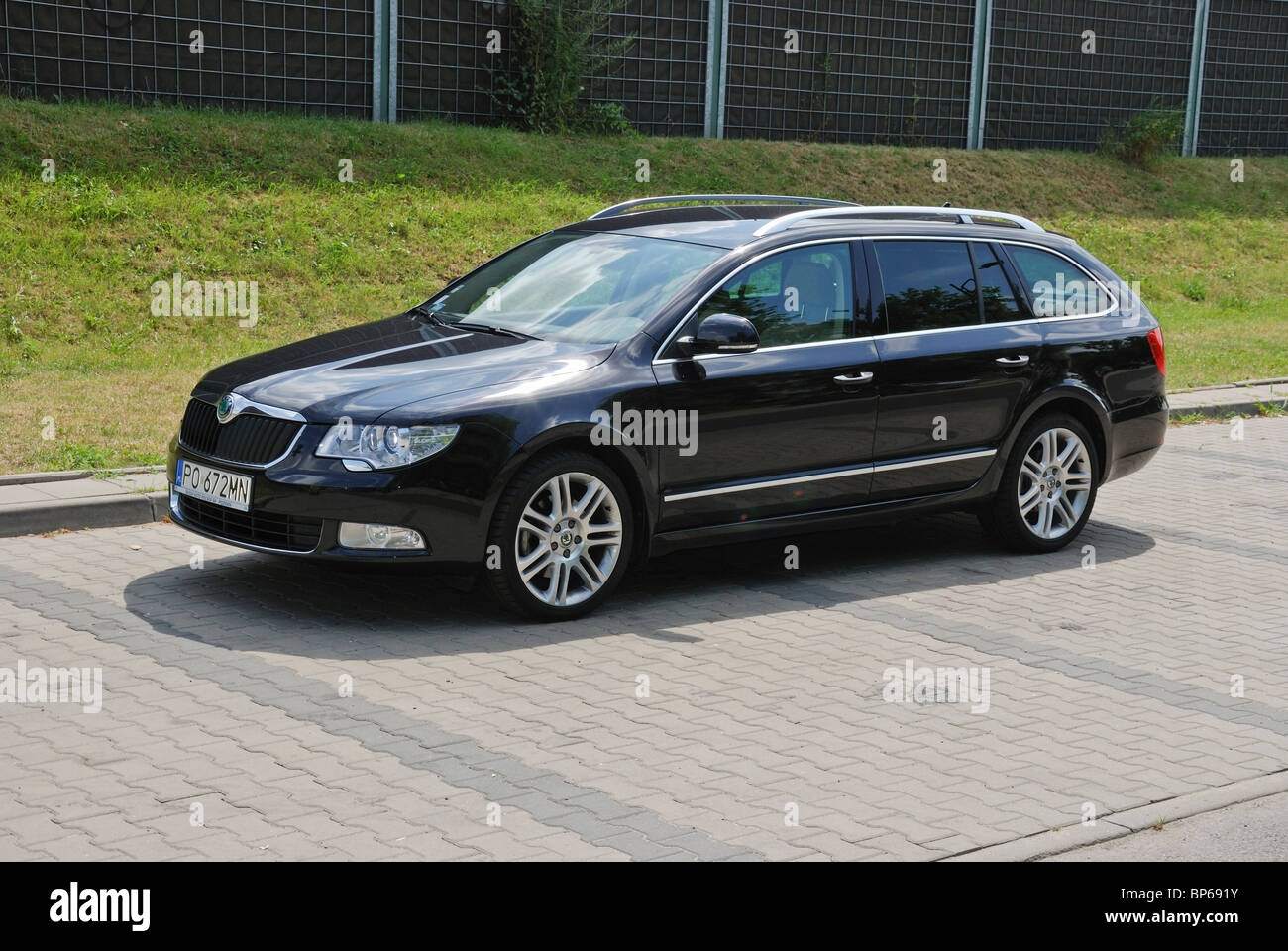 Skoda Superb Combi 2.0 TDI - MY 2010 - brown metallic - Czech popular  upper-medium class car, segment D - in a city Stock Photo - Alamy