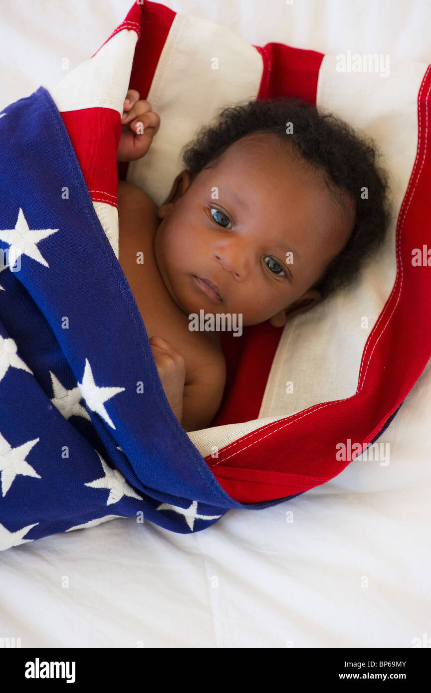 Baby wrapped in American flag Stock Photo Alamy