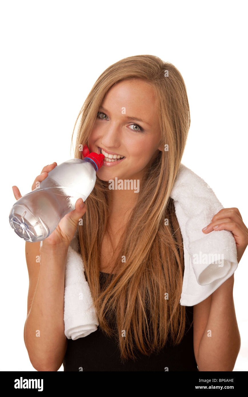 sporty woman drinking water from a bottle Stock Photo - Alamy