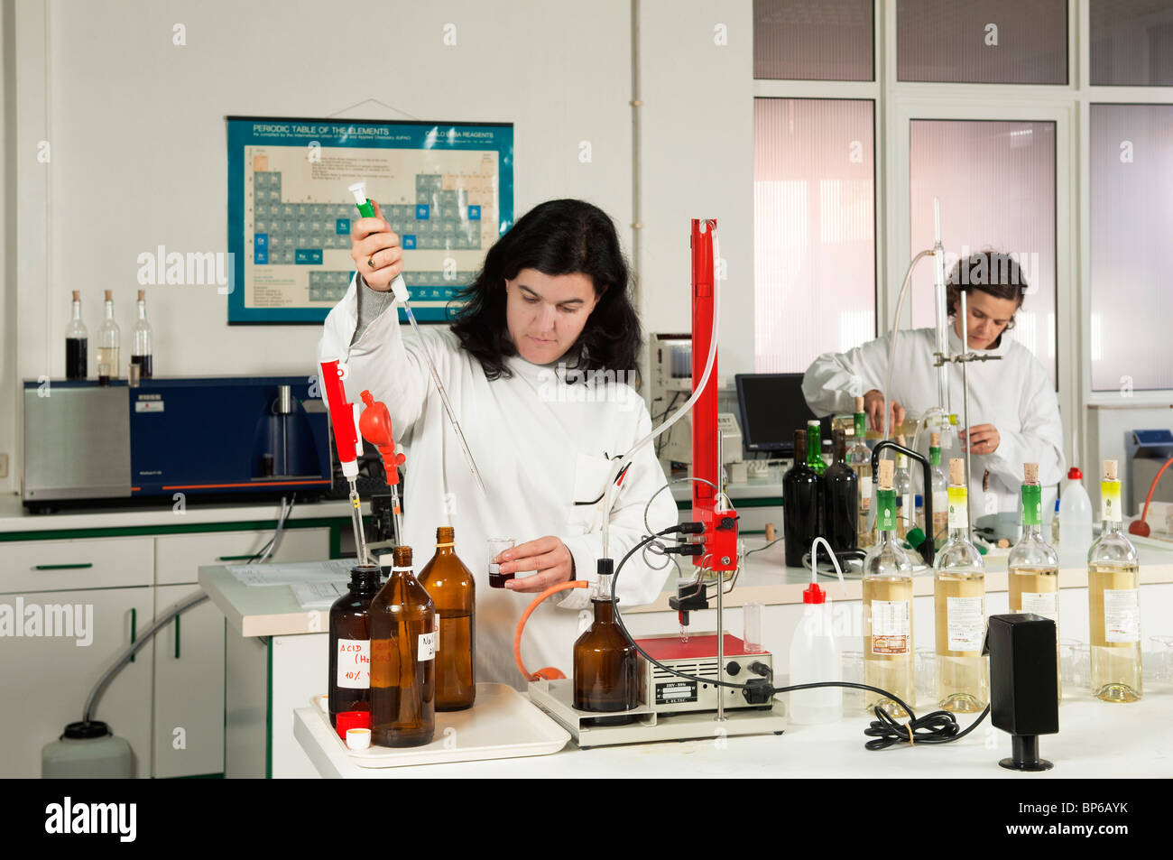 Chemists working at Adega Cooperativa de Borba winery lab, Alentejo