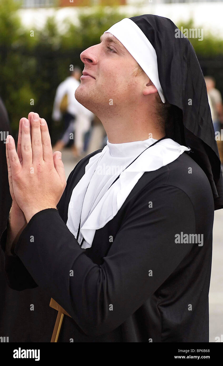 England cricket fan Karl Rigg dressed as a nun and praying for an England victory against Australia in the Ashes, Manchester. Stock Photo