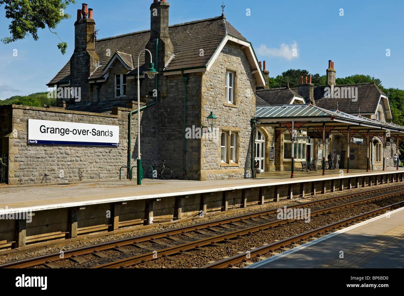 Grange-over-Sands railway train station platform track line in summer Cumbria England UK United Kingdom GB Great Britain Stock Photo