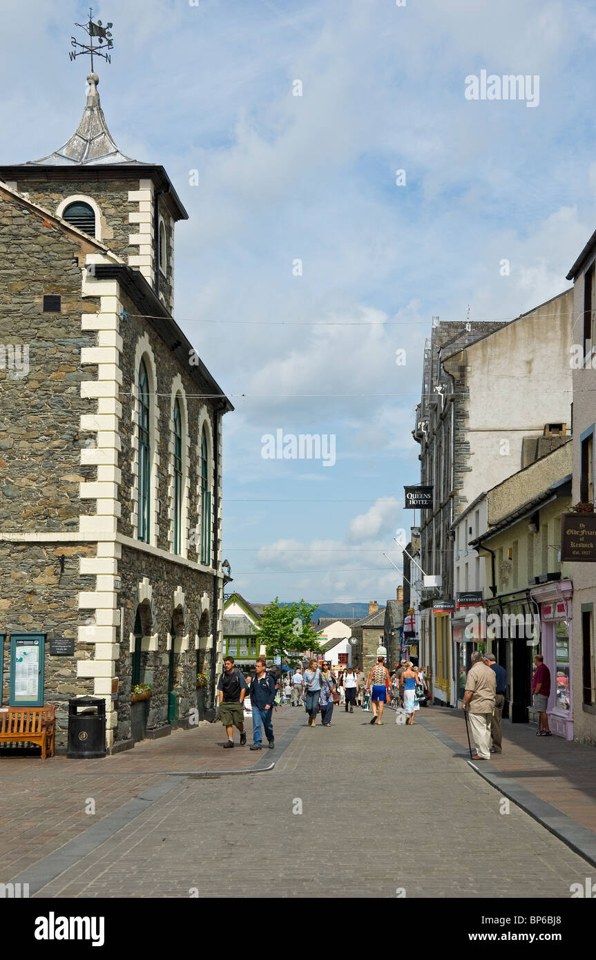 People tourists visitors in Main Street Keswick town centre in summer Cumbria England UK United Kingdom GB Great Britain Stock Photo