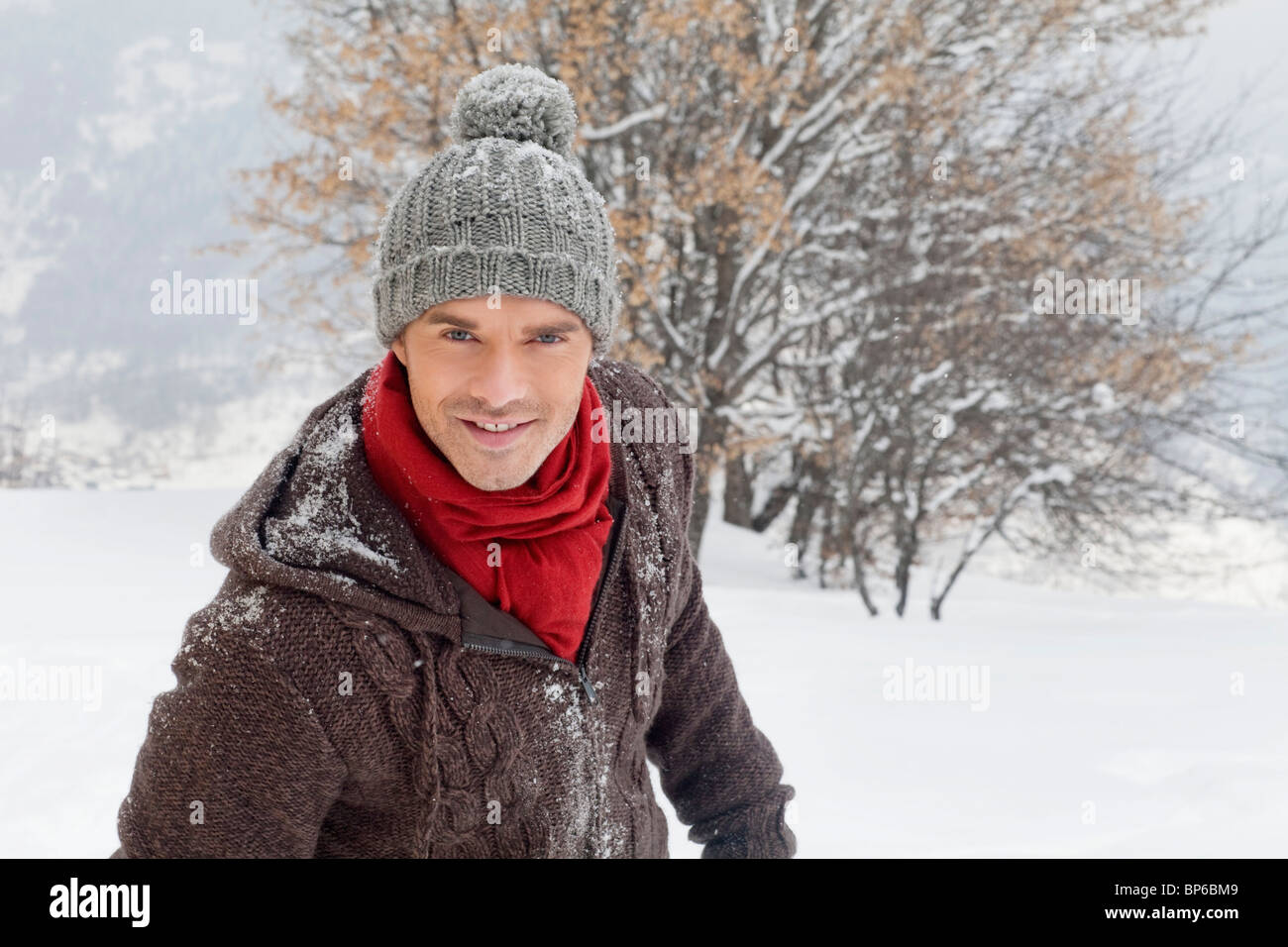 Young man in winter clothes smiling at camera Stock Photo - Alamy