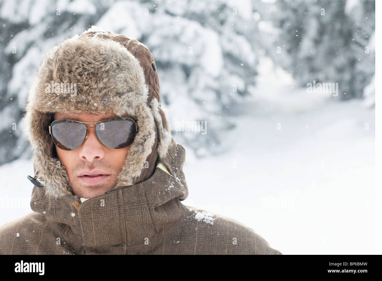 Portrait of young man in winter clothes Stock Photo - Alamy