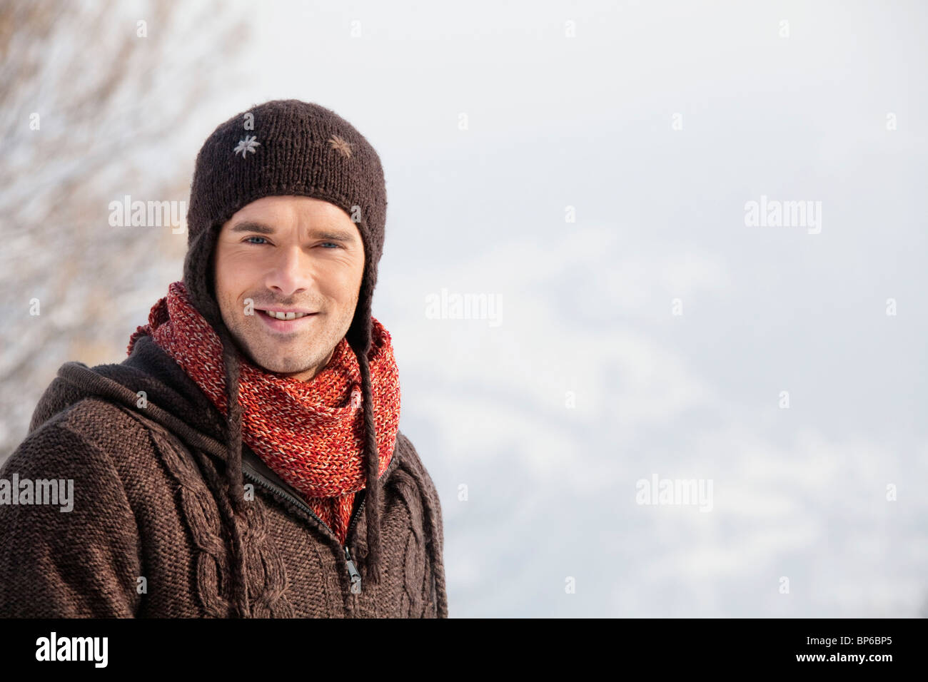 Young man in winter clothes smiling at camera Stock Photo - Alamy