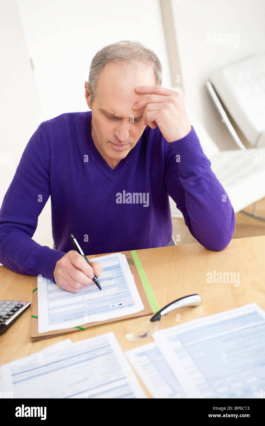 Man Filling His Tax Form Stock Photo - Alamy