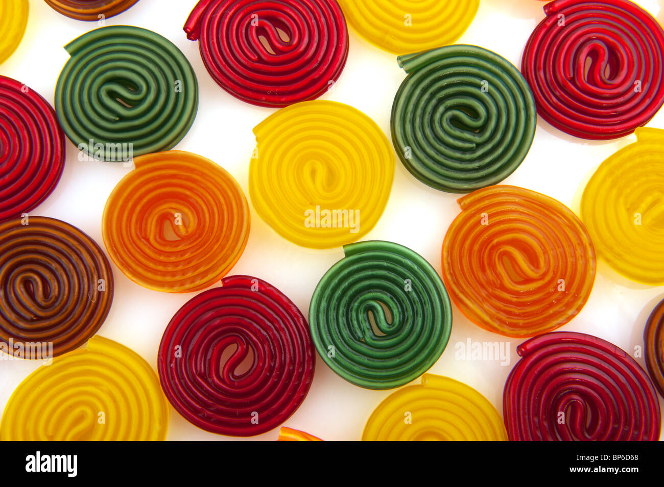 colorful licorice candy drop rolls isolated white background Stock
