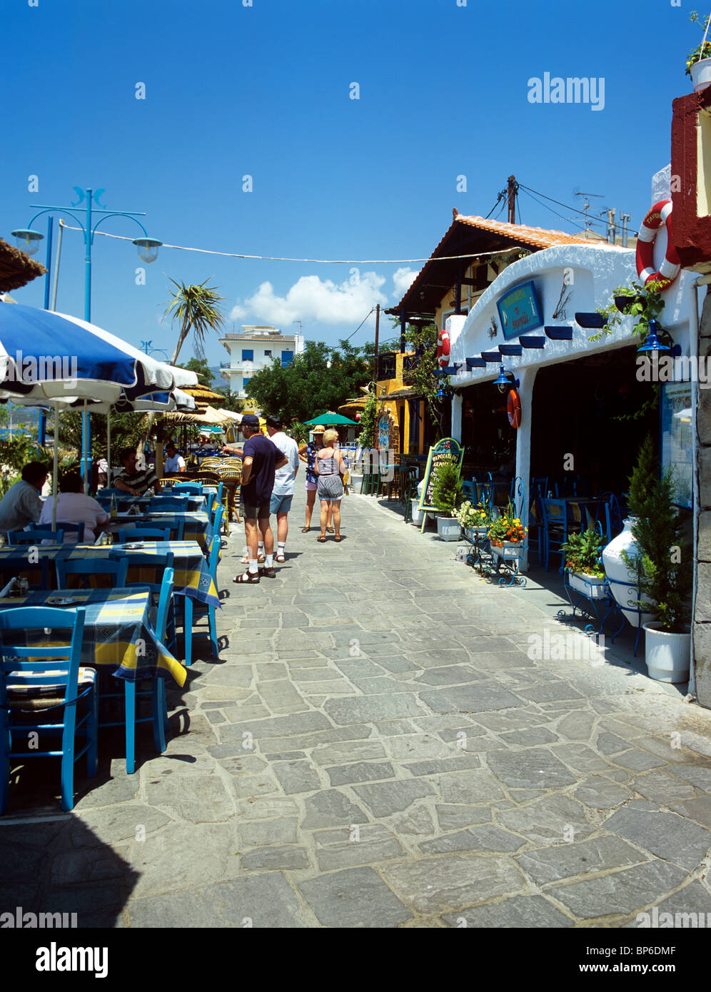 Tavernas line the promenade in the picturesque resort of Potos on ...