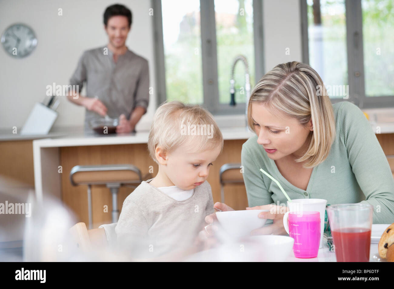 Family at a breakfast table Stock Photo - Alamy