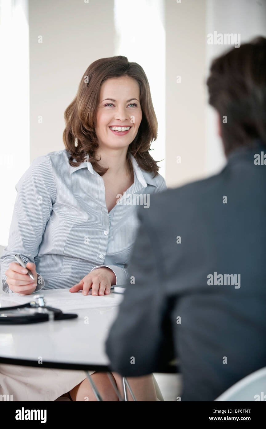 Woman talking with a man Stock Photo - Alamy