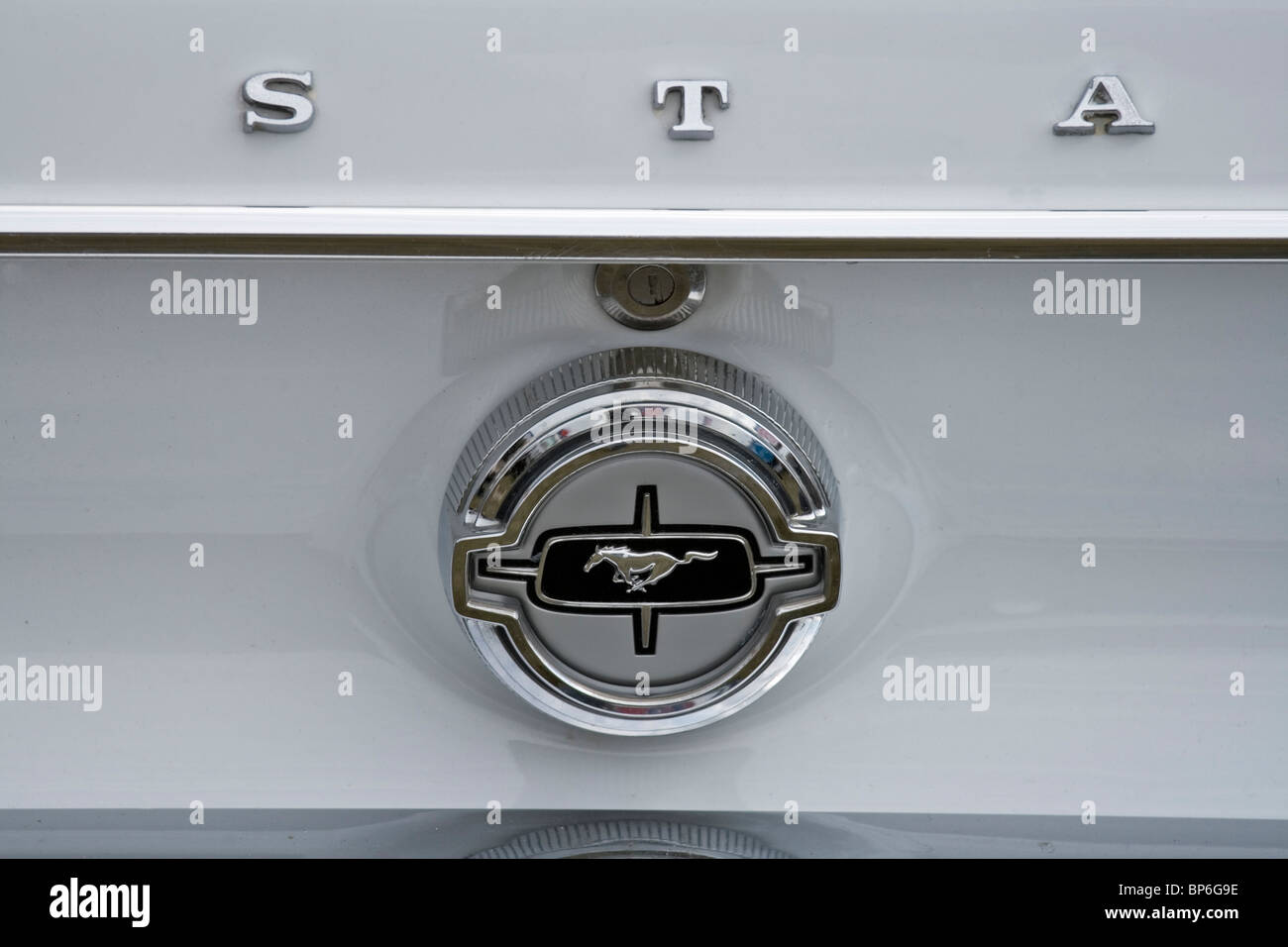 Tailgate badge on a classic Mustang restored car showing the iconic galloping horse Stock Photo