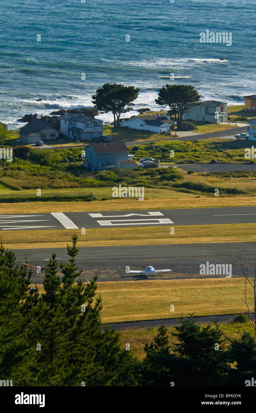 Airplane, runway, houses, and ocean at Shelter Cove, on the Lost Coast, Humboldt County, California Stock Photo