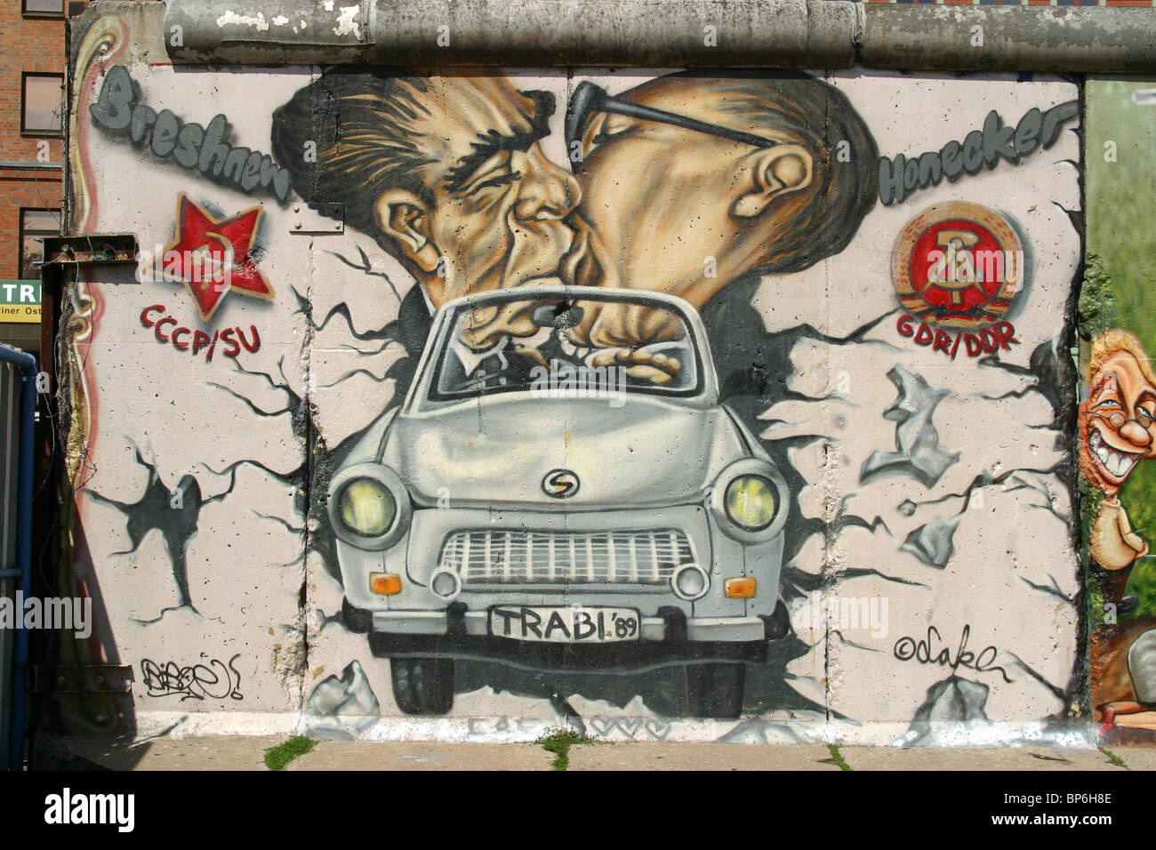 graffity arts with trabant and communist leaders on the Berlin Wall - East Side Gallery in Berlin, Germany Stock Photo