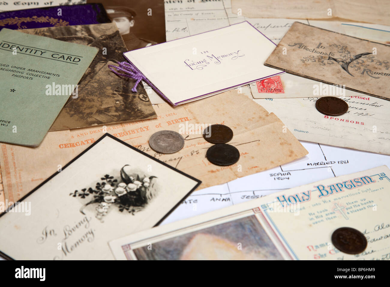 A collection of family documents and photographs being used to research