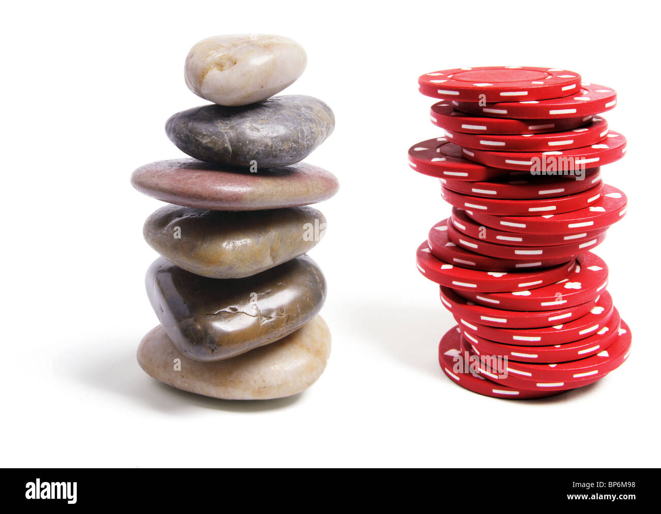 Stack of Poker Chips and Pebbles Stock Photo