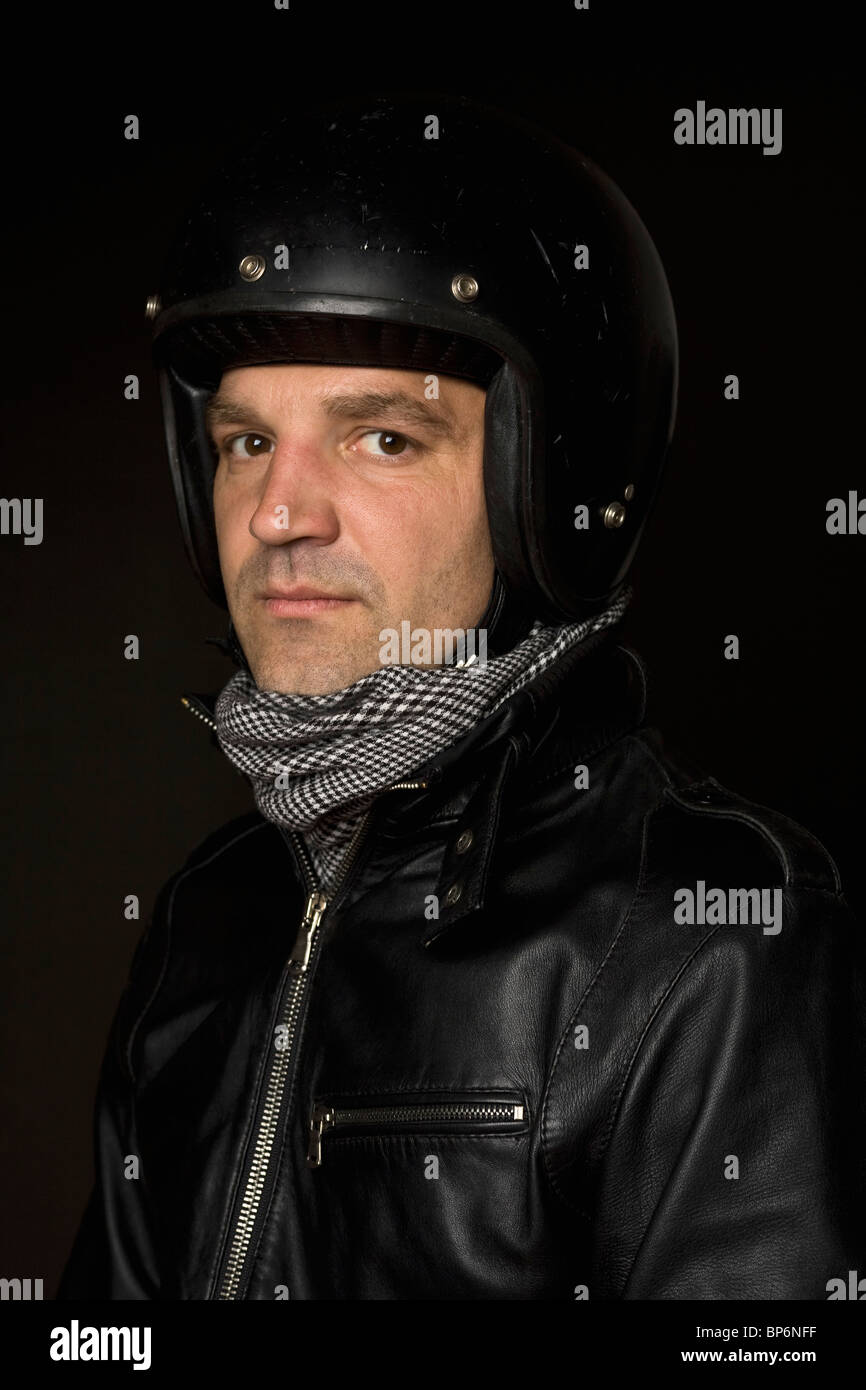 Portrait of a man wearing a helmet and leather jacket Stock Photo Alamy