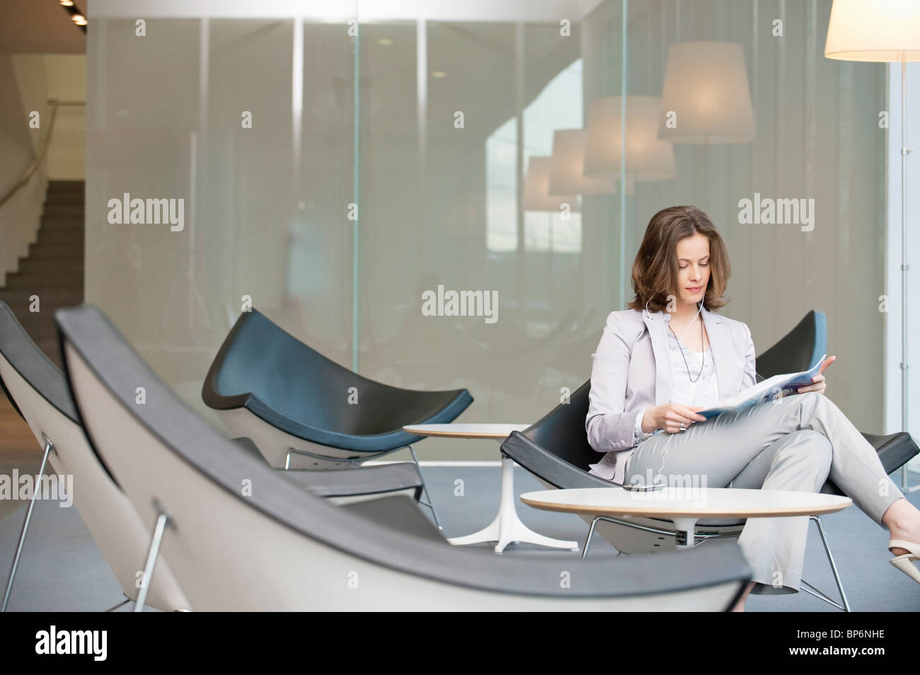 Woman sitting chair full length hi-res stock photography and images - Alamy