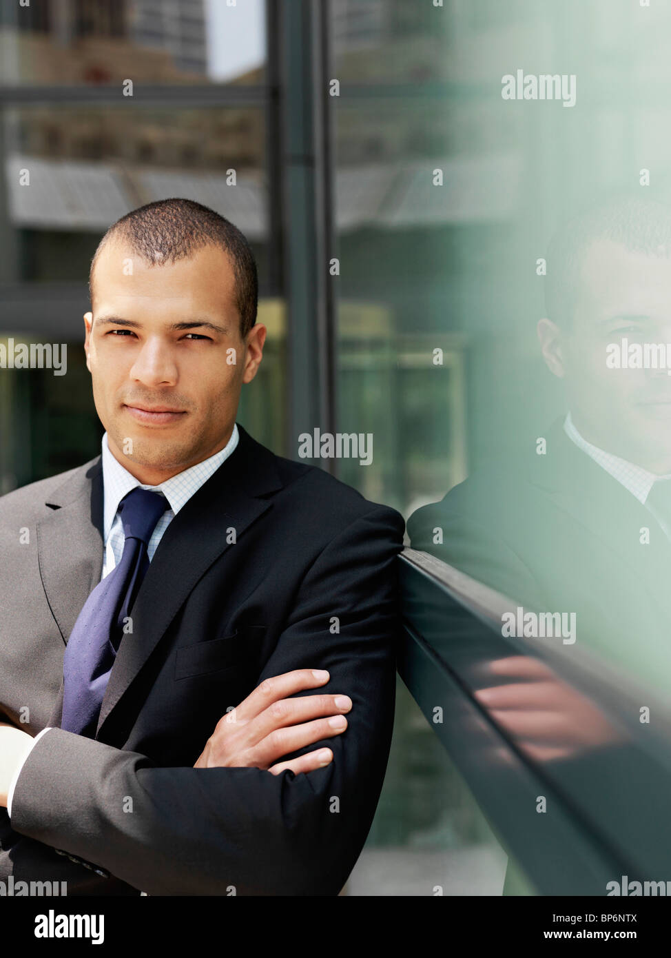Portrait of a businessman with his arms crossed Stock Photo - Alamy
