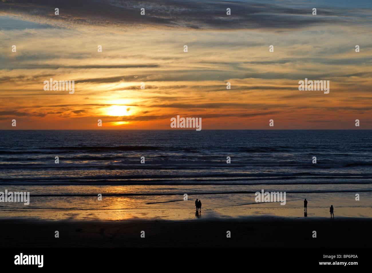 View at sunset of Ninety Mile Beach, New Zealand Stock Photo
