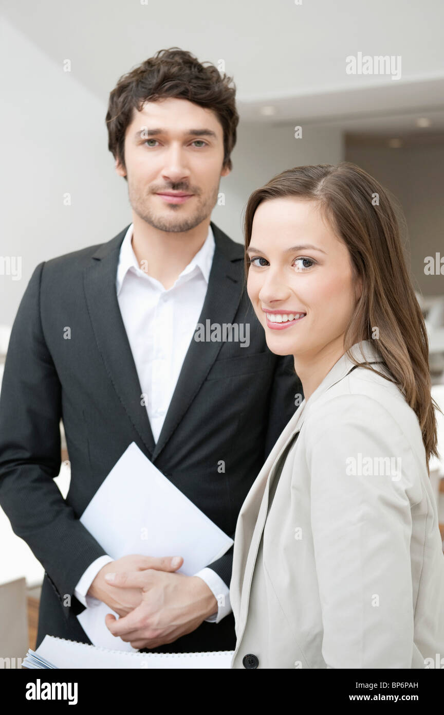 Portrait of two business executives smiling Stock Photo - Alamy