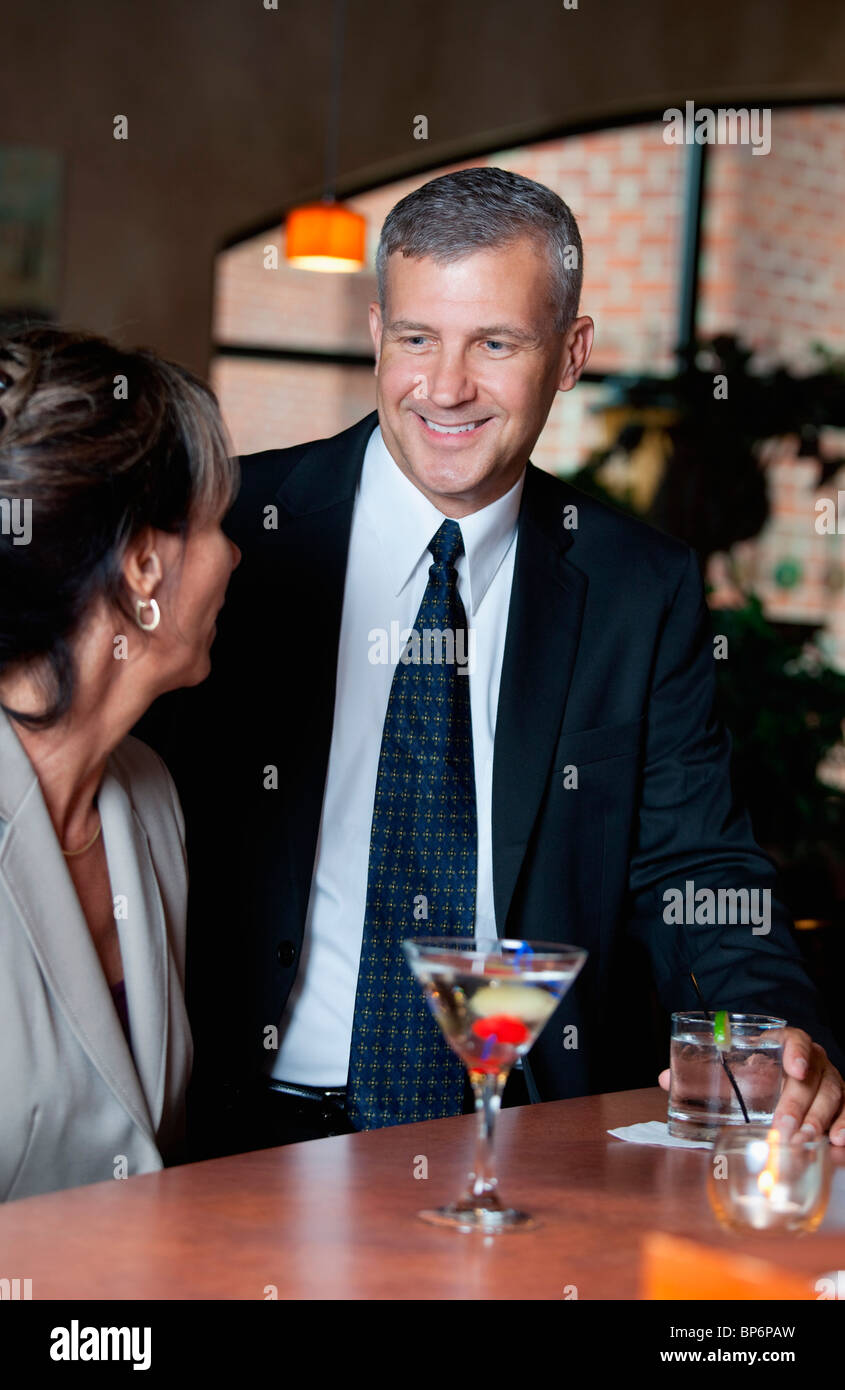 Two business people at a bar Stock Photo