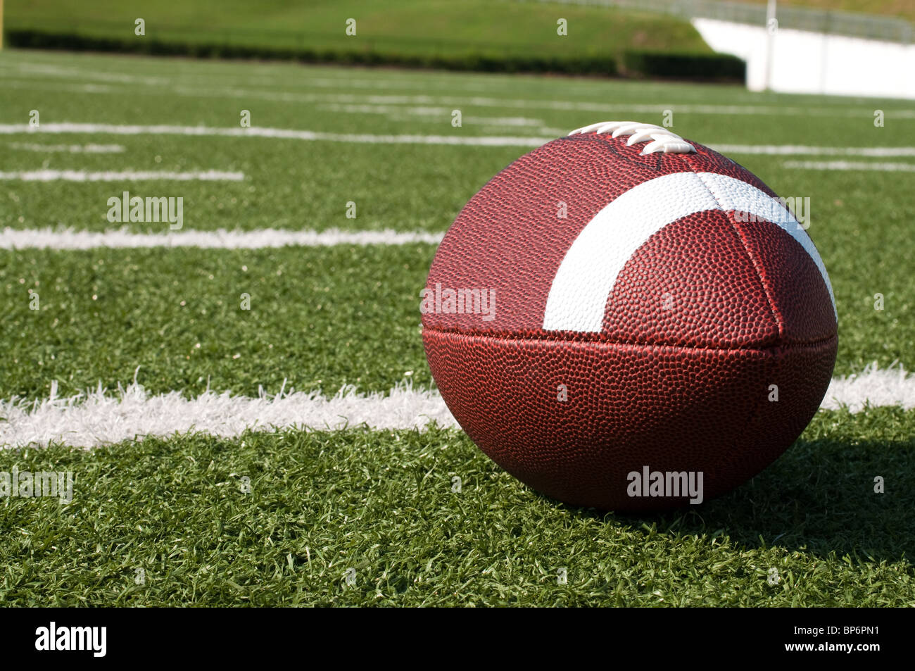 Closeup of American football on field. Stock Photo
