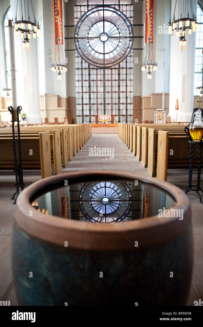 Baptismal Font reflects Rose Window at St. Mark's Cathedral in Seattle Stock Photo