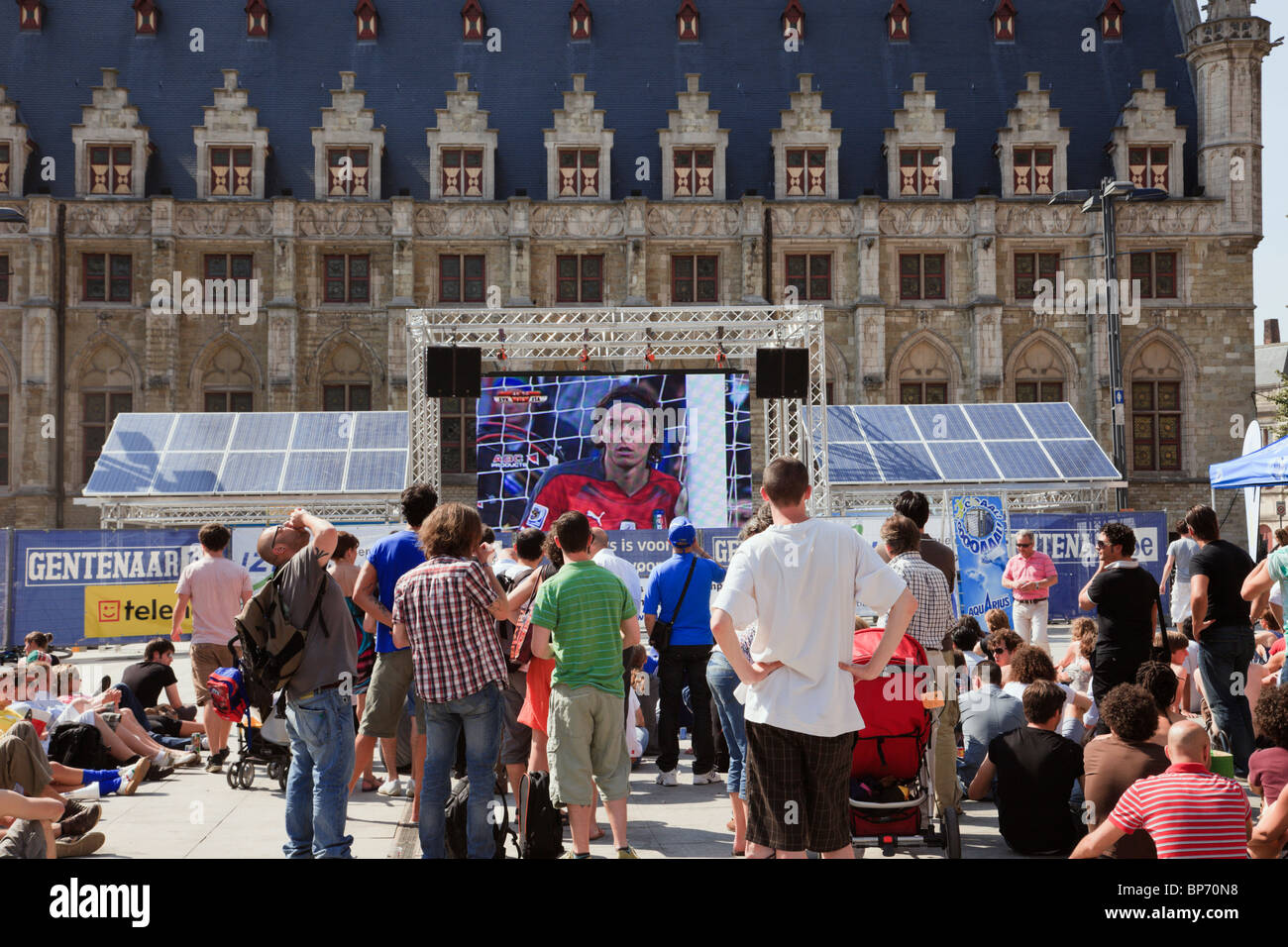 Sint-Baafs Plein, Ghent, Belgium. Crowd of people outside watching World Cup live football on big screen solar television Stock Photo