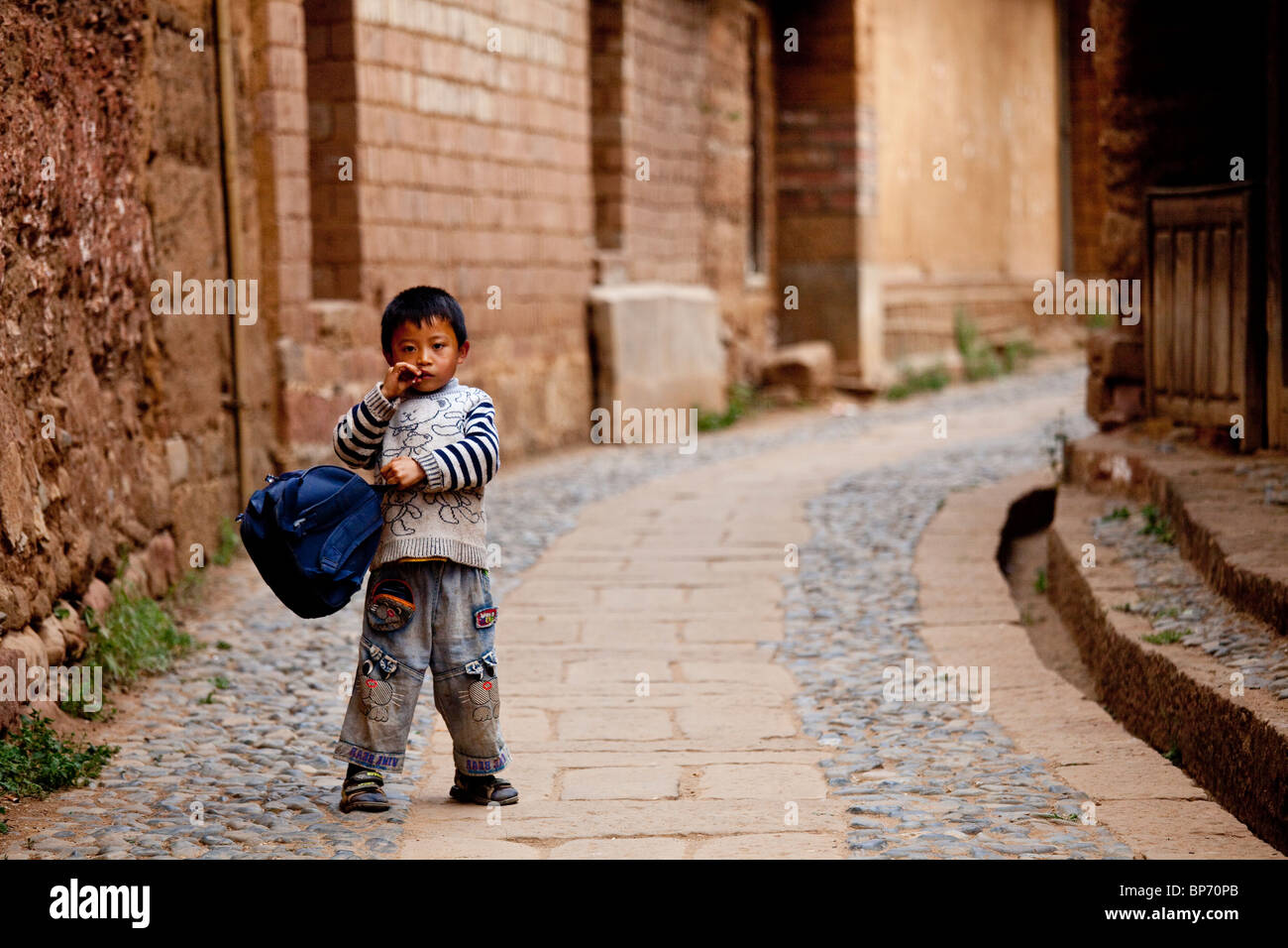 Young Chinese boy in Shaxi Village, Yunnan Province, China Stock Photo