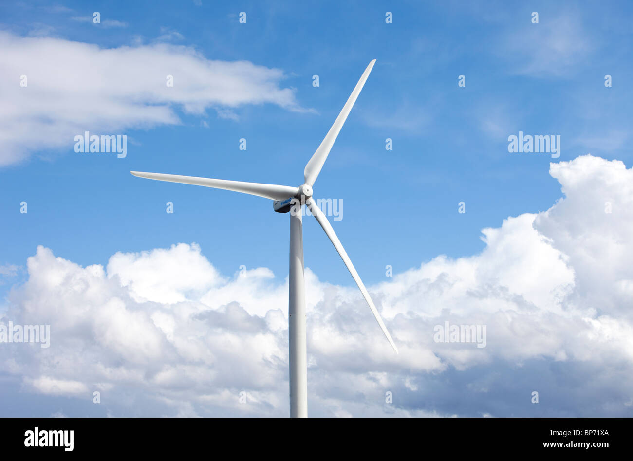 Wind turbine against blue sky and white clouds , Finland Stock Photo ...