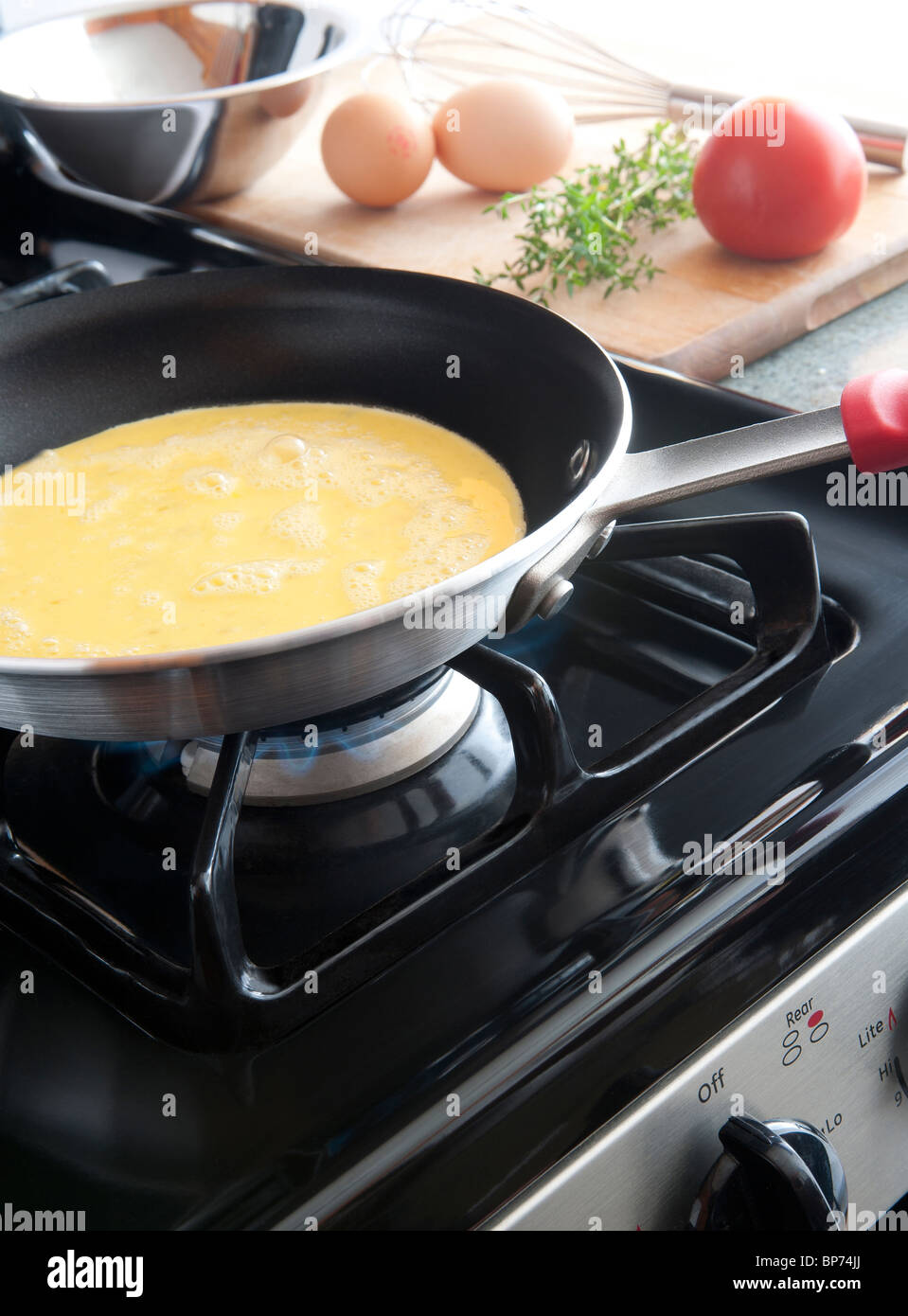 OMELETTE COOKING IN PAN Stock Photo Alamy