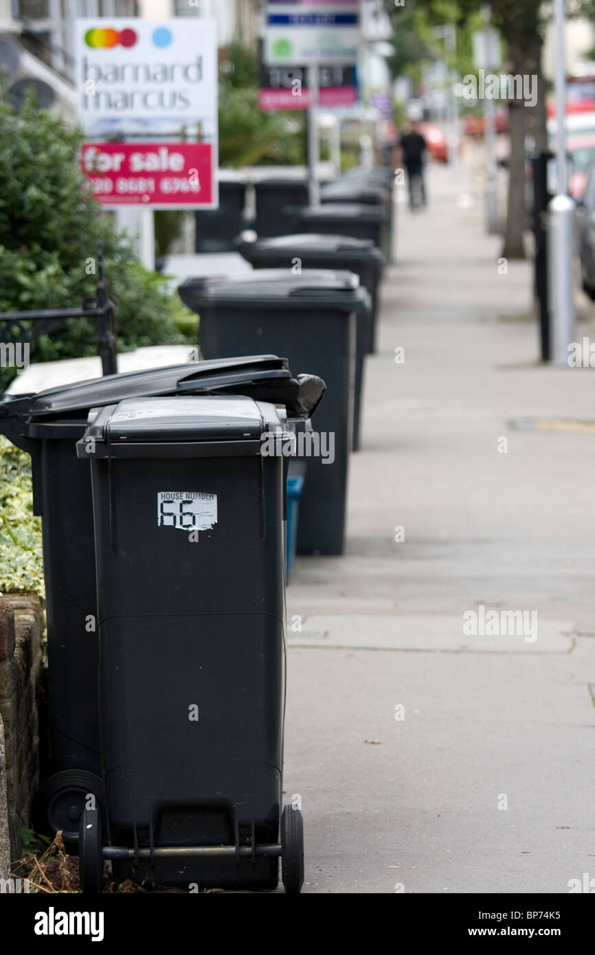 Wheelie bins in a London street Stock Photo Alamy