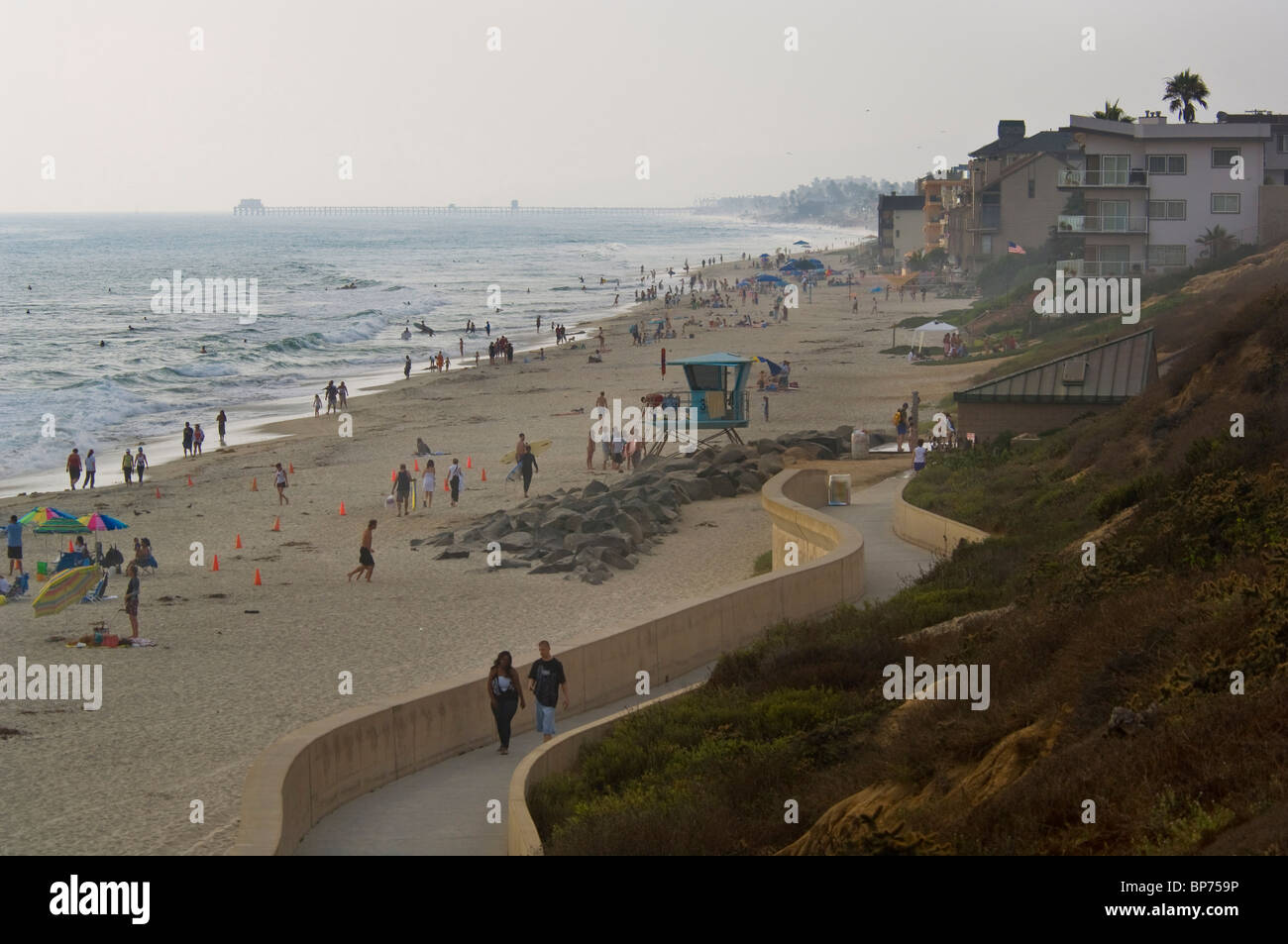 The Seawall walking path next to sand at Carlsbad State Beach, Carlsbad