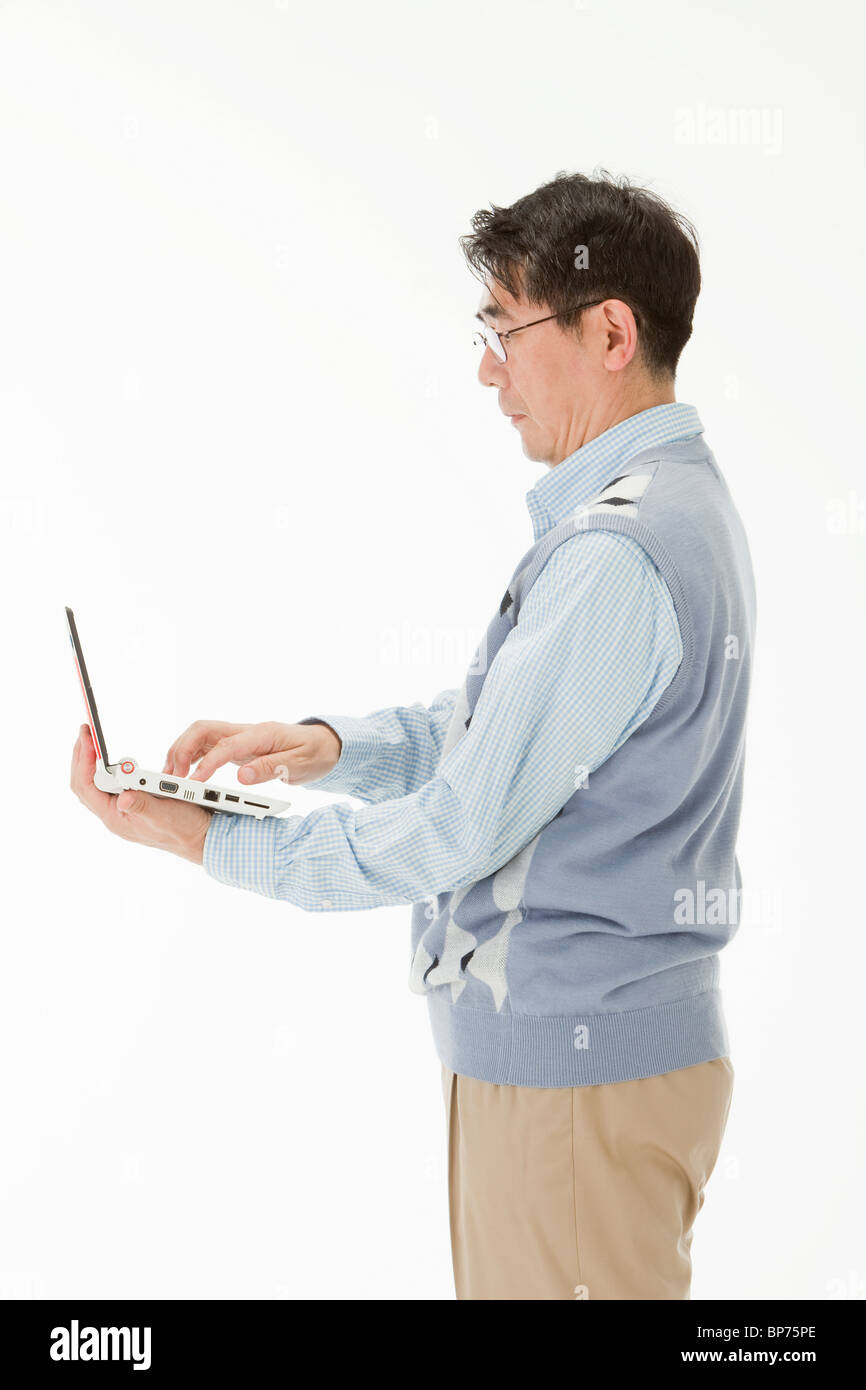 Mature man holding color Cut Out Stock Images & Pictures - Alamy