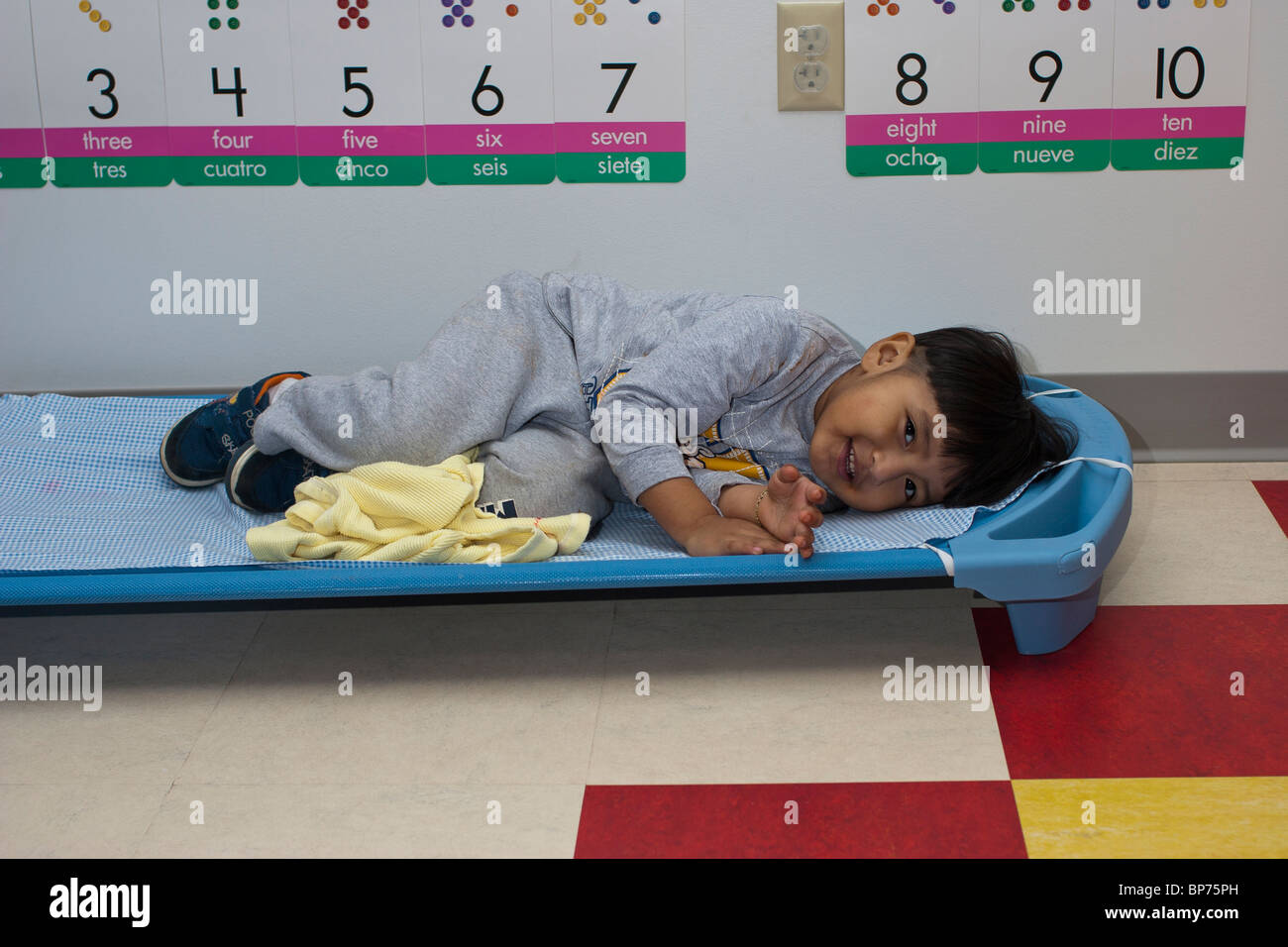 4 year old preschool boy lying on a cot during nap time at school Stock  Photo - Alamy