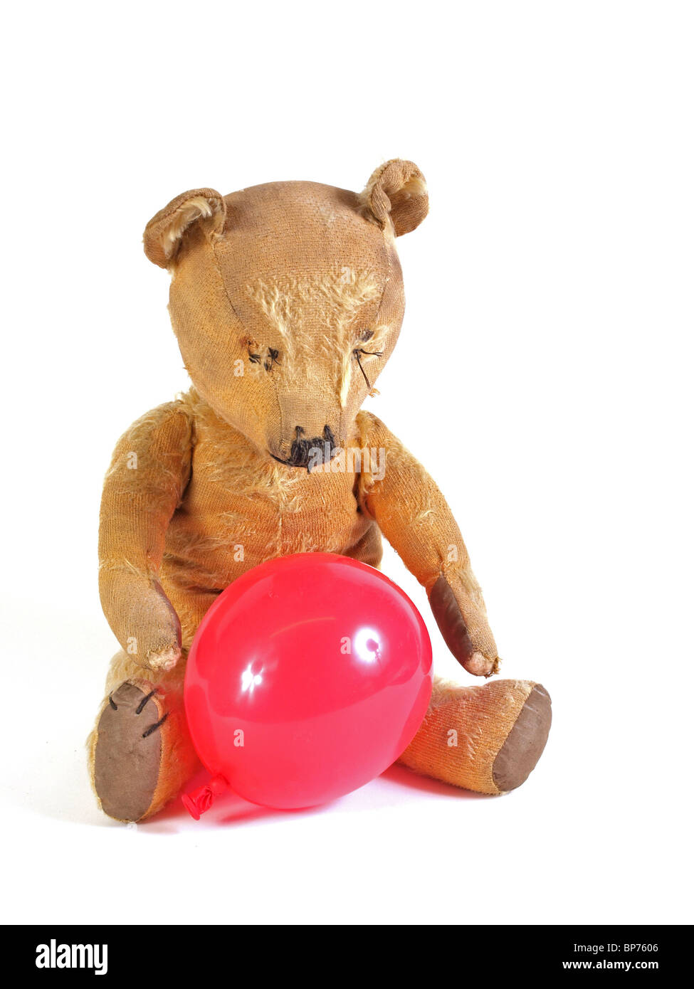 1950 teddy bear with a red balloon. Stock Photo