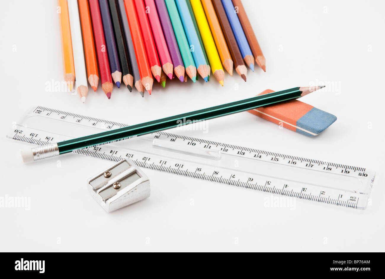 Basic school supplies with colored pencils, pencil, eraser, sharpener