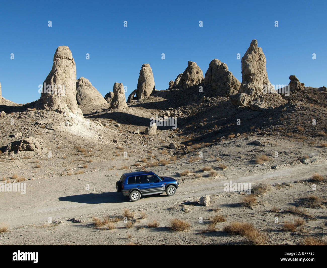 A blue four wheel drive at Trona Pinnacles in the Mojave Desert. Stock Photo