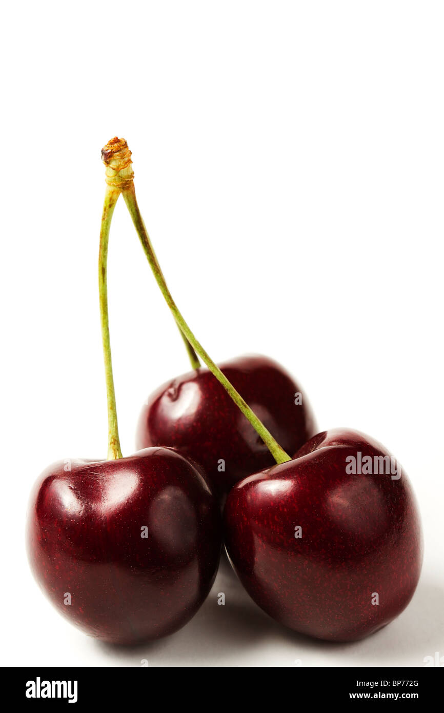 three cherries on white background Stock Photo