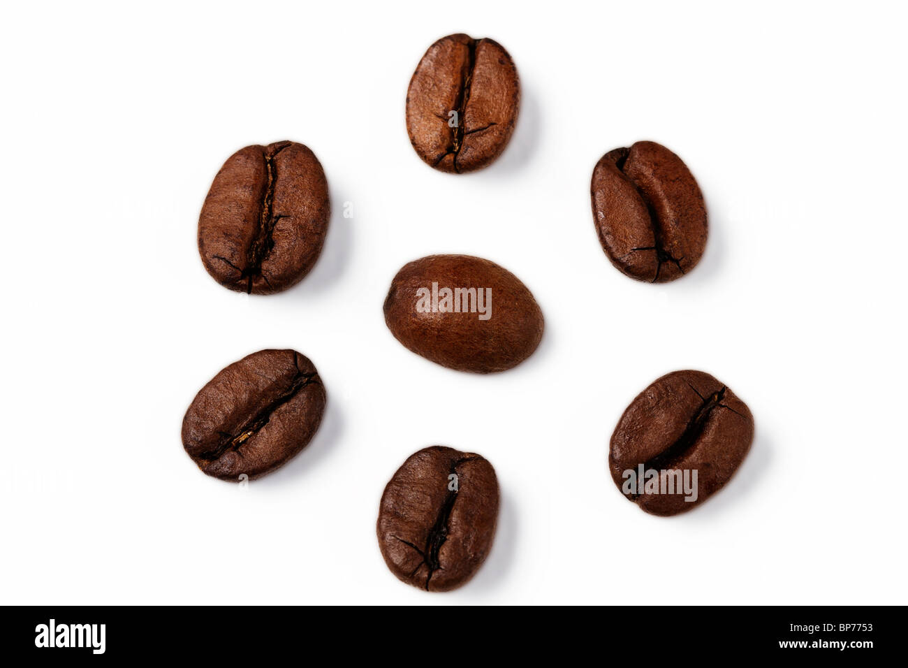 closeup of one coffee bean surrounded by other coffee beans Stock Photo