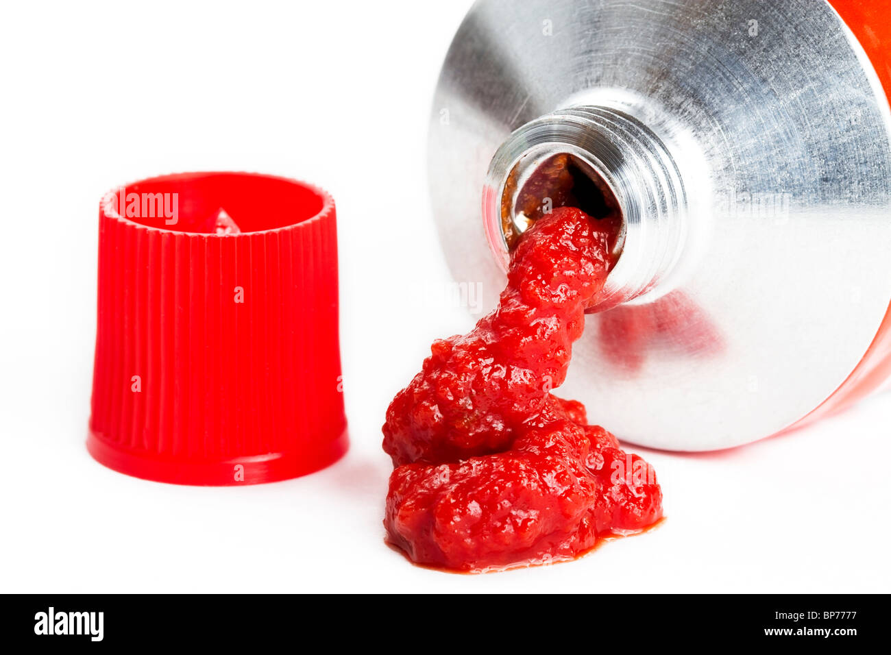 some tomato puree comes out of a tube Stock Photo Alamy