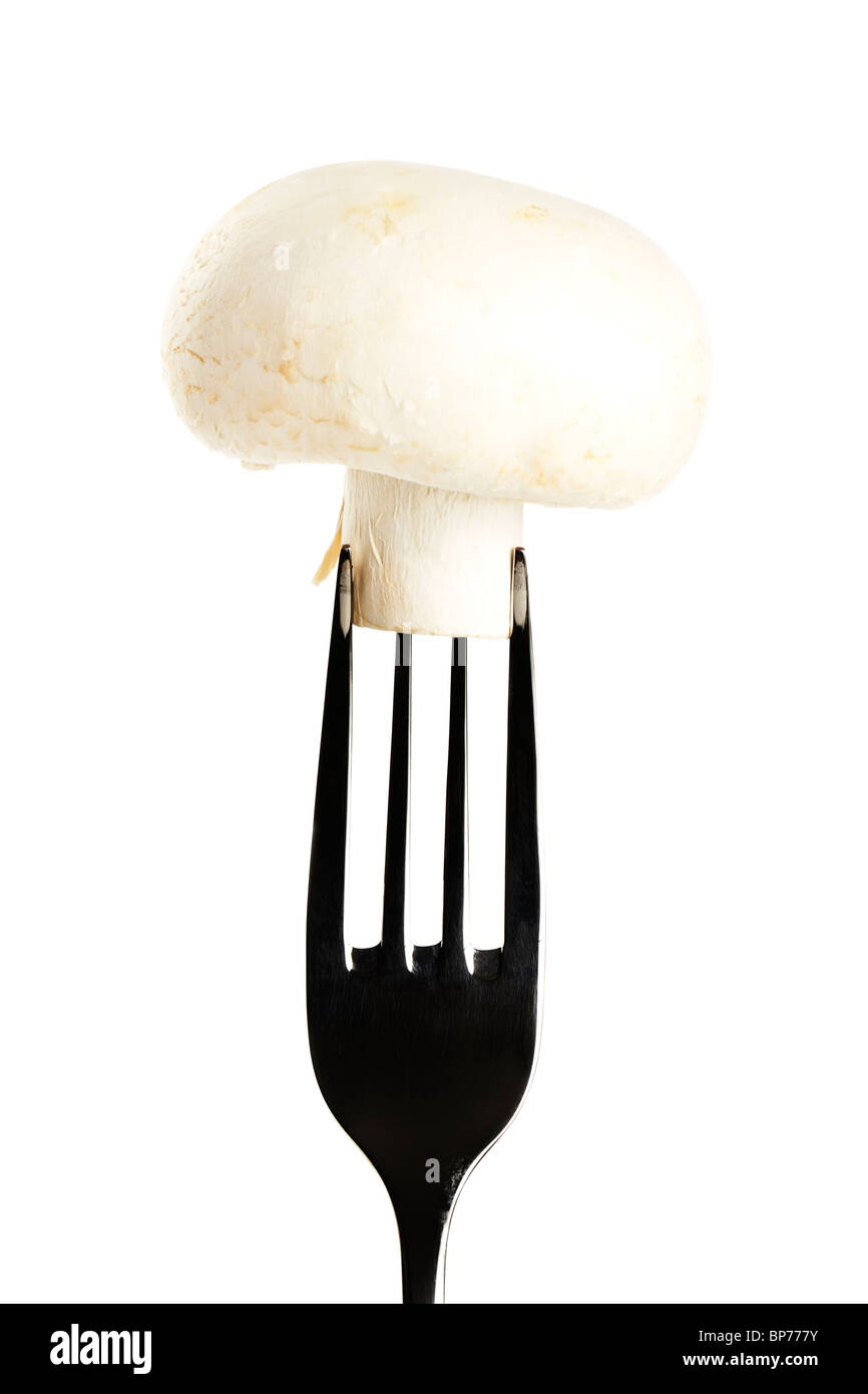 one white mushroom on a fork isolated on white background Stock Photo