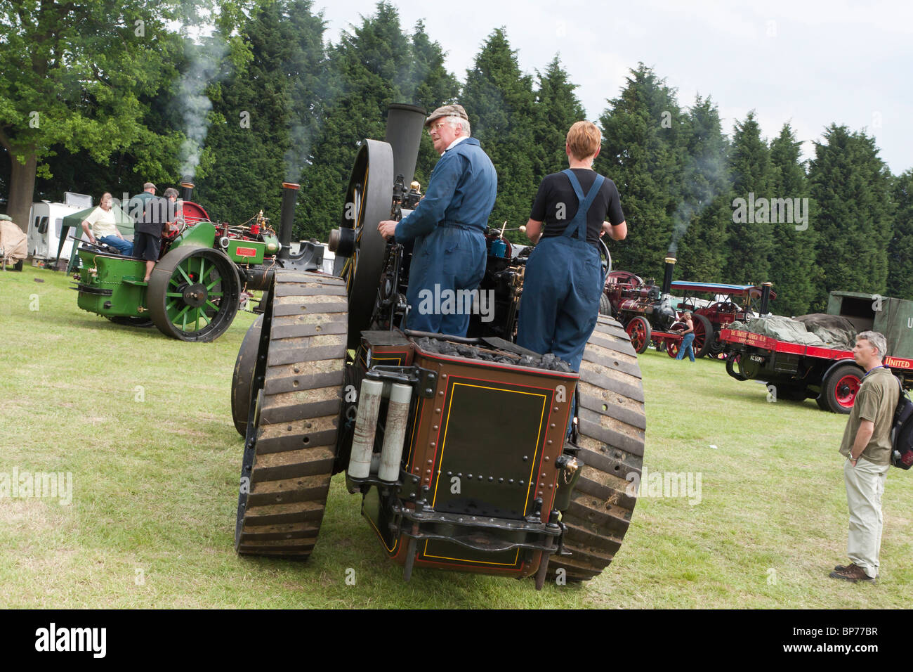 A couple of people driving a traction engine Stock Photo