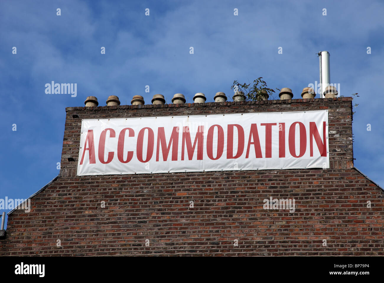 Accommodation sign, gable end, Dublin Docklands Stock Photo