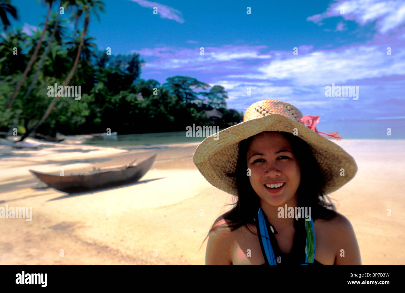 Woman wearing straw hat on a beach on Huahine Island Polynesia Stock ...