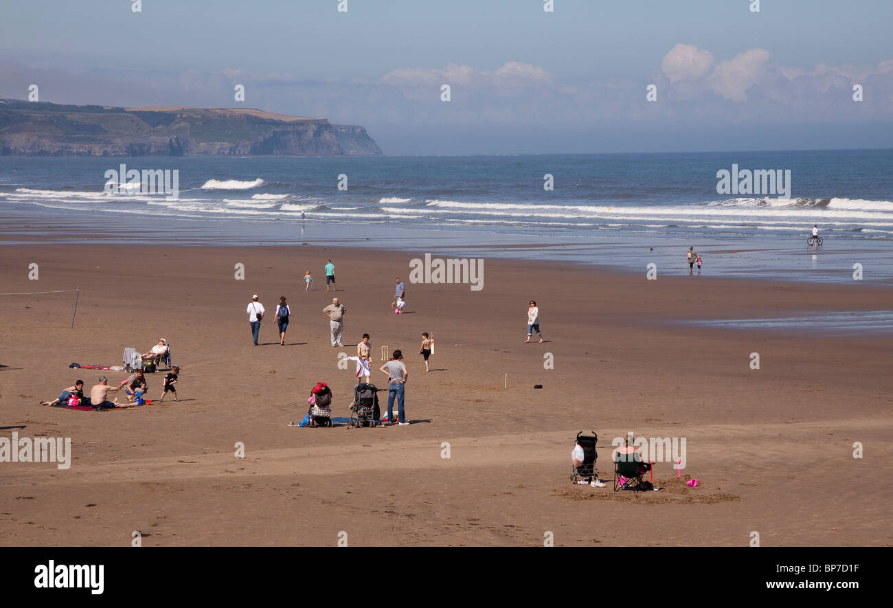 People having fun at the beach in Whitby, North Yorkshire, England Stock Photo