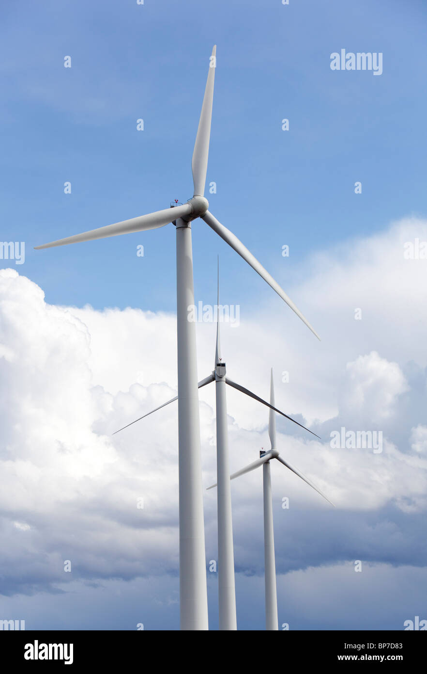 Wind turbines against blue sky and white clouds , Finland Stock Photo ...
